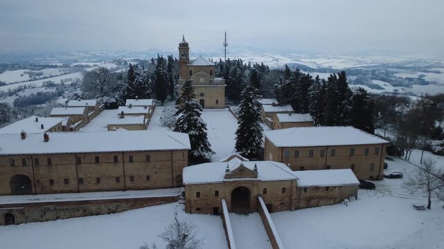 Fano snow in monastery Eremo di Monte Giove with drone 4k