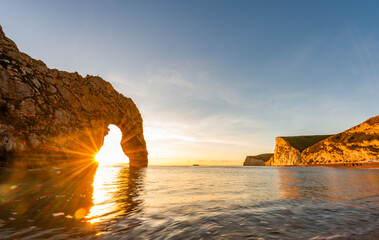 Durdle Door sea arch at sunset Dorset England