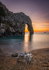 Durdle Door sea arch at sunset Dorset England