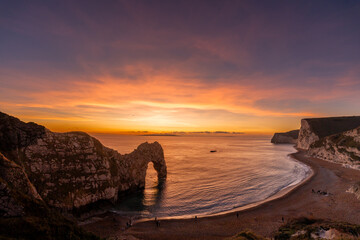Durdle Door sea arch at sunset Dorset England