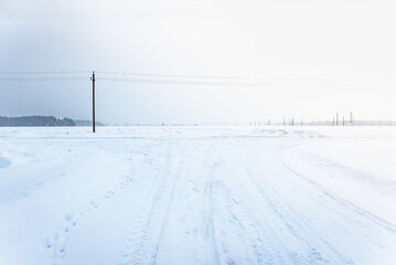 Cleared winter road after a snowfall in the private sector of houses.