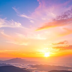 A vivid sunrise paints the sky in shades of pink, orange, and blue above distant mountains shrouded in mist