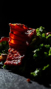 Crispy pork belly shards cast long shadows on vibrant kale, a chiaroscuro symphony of textures, low angle,  pad kana moo krob,  kale