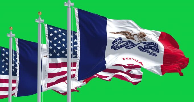 Iowa state flag waving in the wind with the US flag isolated on green background