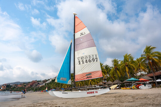 Hobie 16 sailing catamaran on the sand of La Ropa Beach in Ixtapa Zihuatanejo, Costa Grande of Guerrero. Nautical equipment ready to sail. Mexico, January 19, 2026