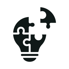 Puzzle pieces forming a lightbulb