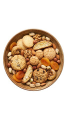 Obraz premium A wooden bowl seen from directly above, filled with a delightful assortment of cookies, nuts, and dried fruits, on a transparent background.