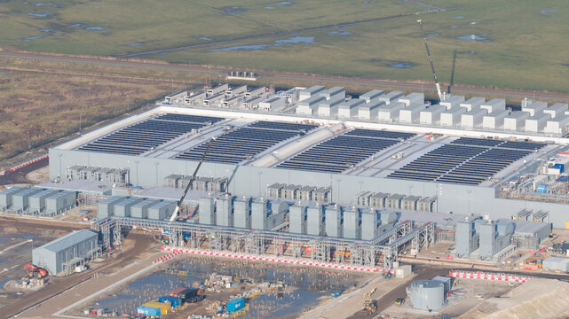 Groningen, Netherlands - 20 January 2026: Aerial view of the expansive Google data center under construction, a stark contrast to the soft, muted tones of the surrounding Dutch landscape.