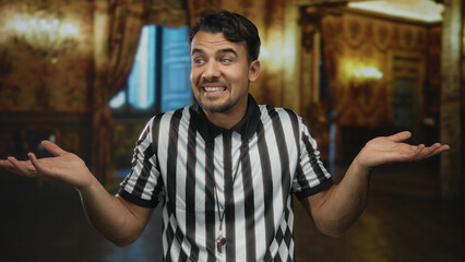 Young hispanic man wearing referee uniform making uncertain gesture inside museum with ornate decor...