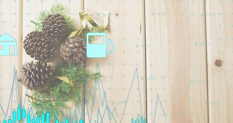 Displaying pine cones with green sprigs and gold ribbon on pale wooden planks, aqua data overlays