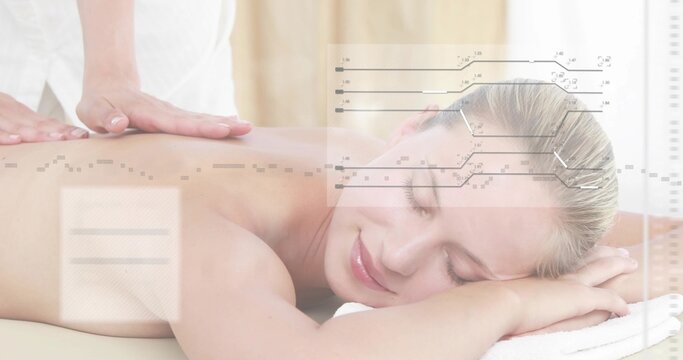 Receiving woman lying face down on massage table, therapist placing hands, white towel, overlay