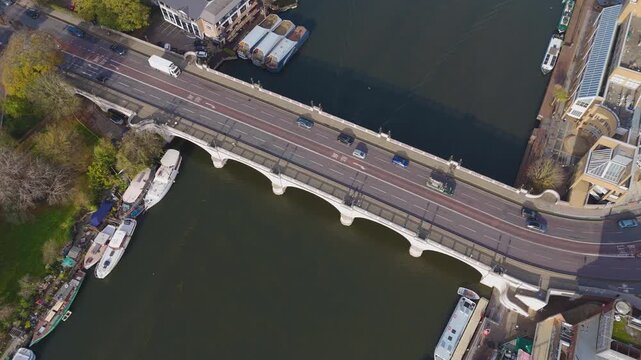 Drone aerial footage of Kingston bridge across River Thames, England. Kingston Bridge is a road bridge at Kingston upon Thames in London, England.