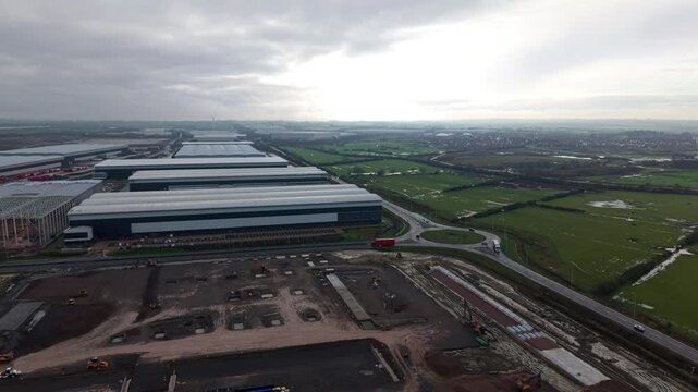 Northampton, United Kingdom - 17 January 2026: Aerial view of the Royal Mail Midlands Super Hub juxtaposes industrial architecture against the lush green landscape.