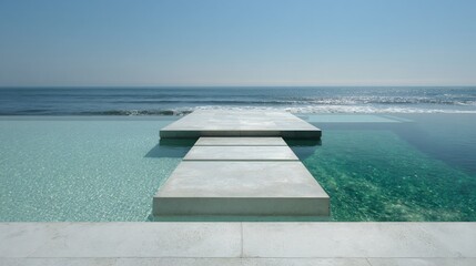 Obraz premium Infinity pool blends into ocean, stepped concrete path to horizon