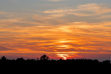 Fototapeta premium Great views of the sun setting at Praia do Canal in Portugal.