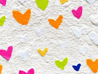 Fototapeta premium Colorful terracotta heart pattern on a pure white background