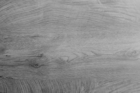 A detailed overhead view of a clean, rich grey wood plank surface. suitable for product photography, menus, blogs, and interior design projects