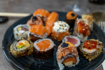 Gourmet seafood plate with maki sushi variation