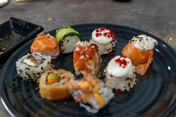 Gourmet seafood plate with maki sushi variation