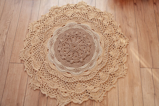 Round crocheted ombre-style rug made of polyester cord