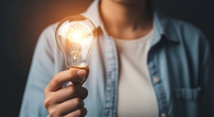 Light bulb idea inspiration innovation creativity solution concept hand holding bright lightbulb energy