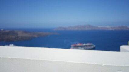 Naklejka premium Blurred coastal seascape with soft bokeh and white foreground wall outdoor; backdrop copyspace backplate.