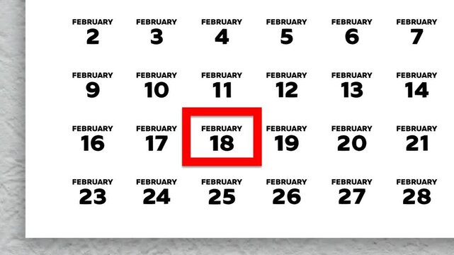 The date February 18th marked with a red cursor on the wall calendar 2026
