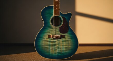 Fototapeta premium Blue acoustic guitar stands serenely in warm sunlight