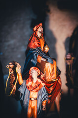 Fototapeta premium Three Wise Men Journeying to Bethlehem Nativity Scene, Biblical Magi Figures with Camel at the Inn Entrance, Epiphany and Christmas Tradition Concept Background
