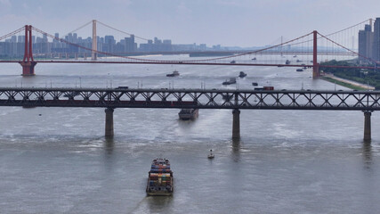 Freighters on Yangtze River at Wuhan with Suspension Bridge