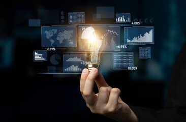 A hand holds a light bulb, symbolizing innovative ideas amidst a backdrop of data visualizations and graphs, representing modern business analytics and strategy development. Scalp