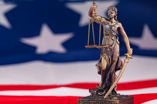 Statue of Justice with American Flag, Symbol of Law and Freedom