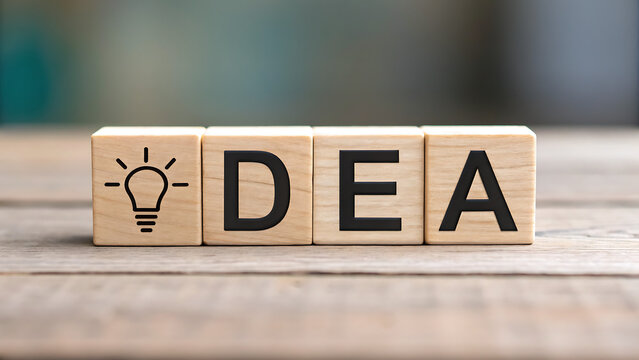 Creative lightbulb and wooden blocks spelling dea