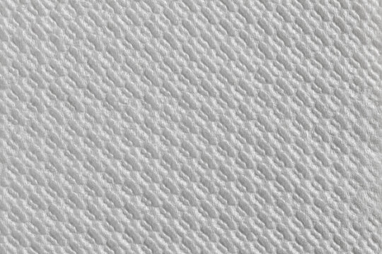 Close-up of white paper towel with diagonal oval pattern. Ideal for hygiene, packaging, and texture design.