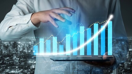 A businessman analyzes growth data using digital graphs and charts on a tablet, set against a vibrant urban skyline at night, symbolizing financial success. Copula