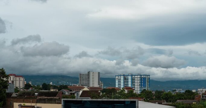 Timelapse of thick clouds rolling over the hills in Bandung, Indonesia
