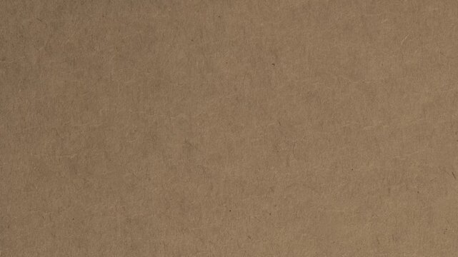 Close up of textured brown paper surface with subtle fibers and granular details