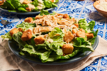 Caesar salad with shredded chicken, croutons and parmesan