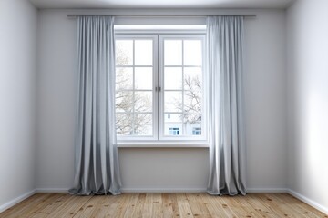 Empty room with a large window draped with light grey curtains.