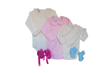 Baby clothes for infants, pink and white with knitted shoes isolated on white background