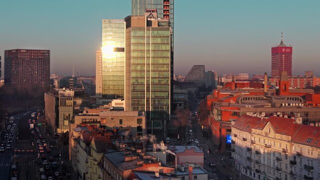 Business skyscrapers urban growth sunset. Contemporary city skyline with glass office towers during golden hour, strong metropolitan expansion theme, financial district atmosphere, modern European cit
