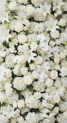 Abundant arrangement of various white blossoms creates a dense floral background texture