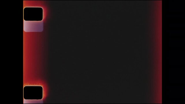 Sixteen millimeter film scan with sprocket holes and light leaks exposed.  Film grain overlay or design element.