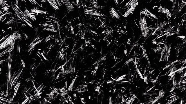 A chaotic abstract pattern of white scratches and marks on a black background