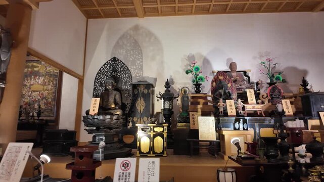 Japanese Temple Room with Multiple Buddhist Statues on Display