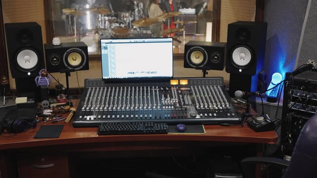 Professional sound studio featuring mixing equipment and monitoring systems