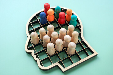 Segmentation inside human head shape symbolizing bias and social stereotypes.