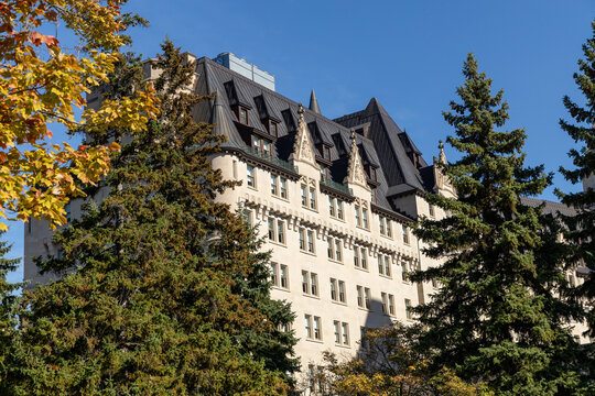 Ottawa, Canada - October 6, 2025: Fairmont Chateau Laurier Hotel building. View of the historic heritage hotel through park foliage