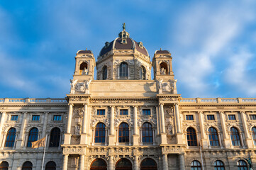 Obraz premium Close-up view of historic museum facade in Vienna, Austria. Classical architecture against blue sky. European cultural heritage.