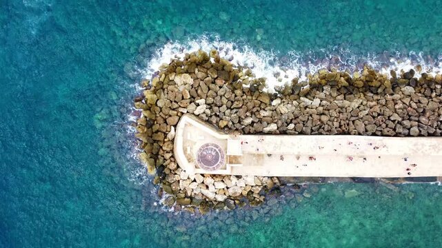 Aerial view of Chania's coastline and pier in Greece